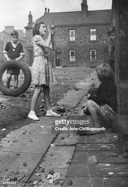 Children playing in Salford. Original Publication: Picture Post - 5461 - Salford In Wonderland - unpub.