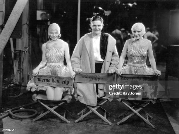 Merna Kennedy the American leading lady, sits with Evelyn Brent and a boy calling himself Glenn on the set of 'DragNet' directed by Josef Von...
