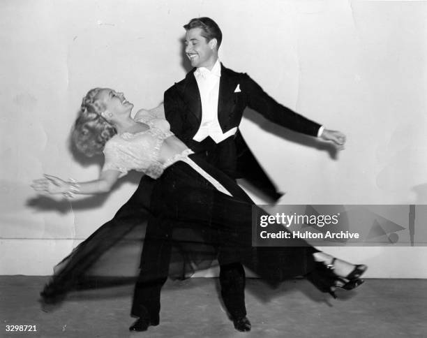 Betty Grable and Don Ameche during a fast dance routine from the musical film 'Down Argentine Way', directed by Irving Cummings for 20th Century Fox.