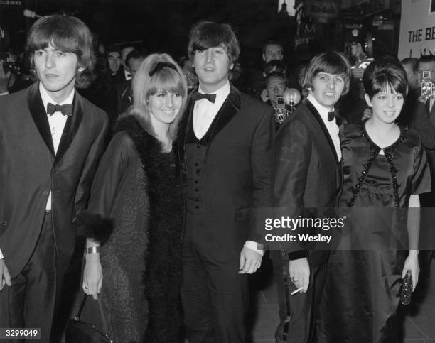 Members of the pop group The Beatles, George Harrison , John Lennon and his wife Cynthia, and Ringo Starr and his wife Maureen, arrive at the...