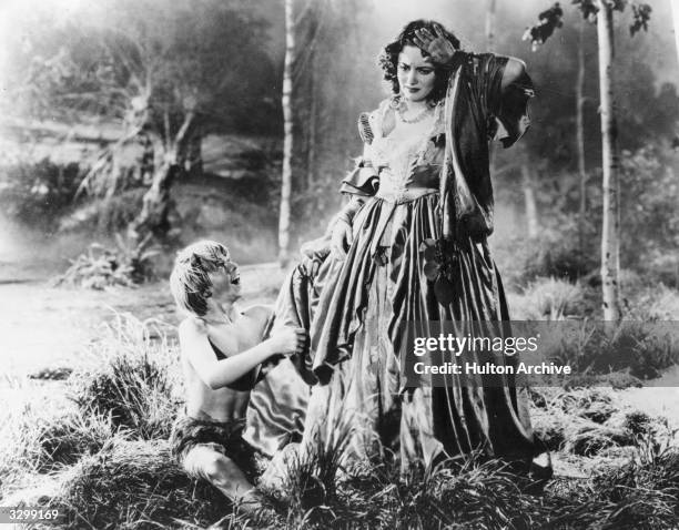 Mickey Rooney as Puck and Olivia De Havilland as Hermia in a scene from Shakespeare's 'A Midsummer Night's Dream', directed by Max Reinhardt and...