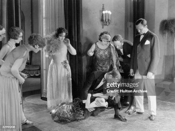 Actors Pauline Frederick and Mae Busch in a scene from the MGM film 'Married Flirts', circa 1924.