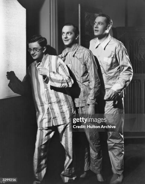 Ian Hunter , Maurice Evans and Charles Hawtrey in a scene from 'Marry Me', directed by Wilhelm Thiele for Gainborough Pictures.