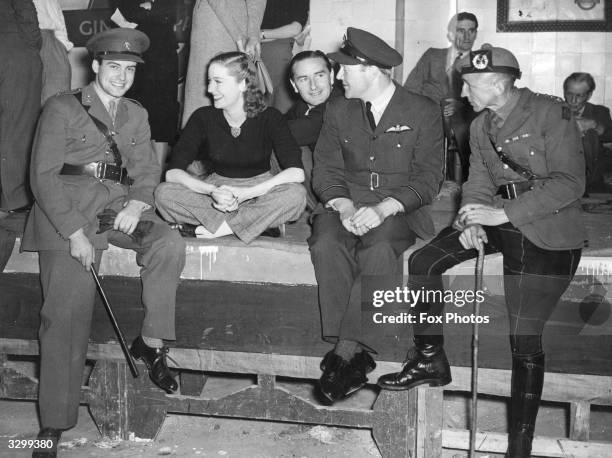 Richard Greene and Valerie Hobson star in the film 'Story Unpublished', for which Richard Greene was allowed temporary leave from the 27th Lancers....