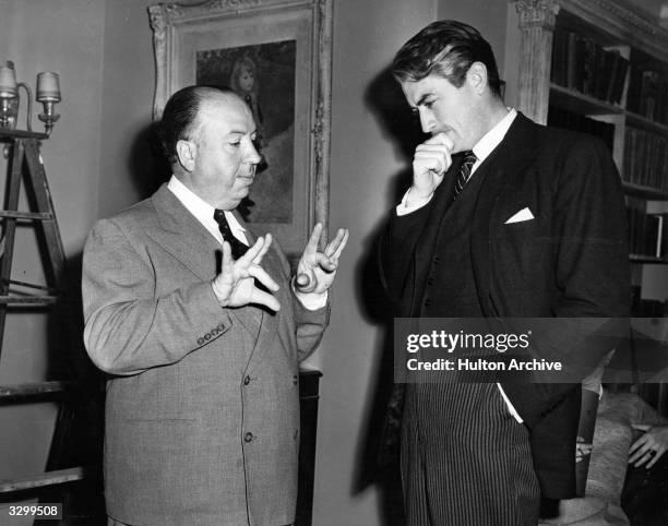 This candid shot of director Alfred Hitchcock with American actor Gregory Peck received second prize in the 4th Hollywood studios still photography...