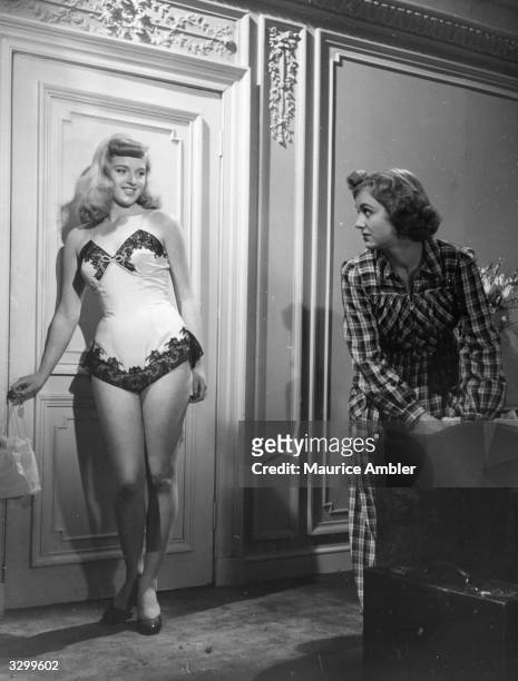 Diana Dors in her underwear with British actress Pauline Stroud in a scene from 'Lady Godiva Rides Again', a film about contestants in a beauty...