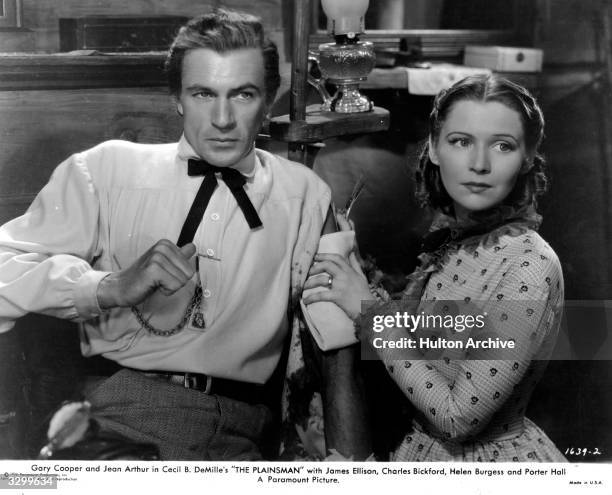 Gary Cooper and Helen Burgess star in 'The Plainsman', the story of Wild Bill Hickok and his friends, directed by Cecil B DeMille.