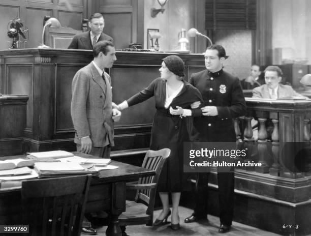 Anita Page creates a stir in the courtroom in a scene from the film 'Justice For Sale' , directed by W S Van Dyke for MGM.