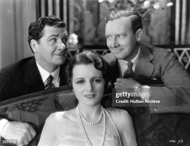 George Bancroft and director Rowland Lee are plotting something but Mary Astor , sitting in front of them is unaware of their intentions. A relaxing...