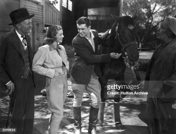 Loretta Young stars in the film 'Kentucky' with Richard Greene , the British leading man. The film was directed by David Butler for 20th Century Fox.