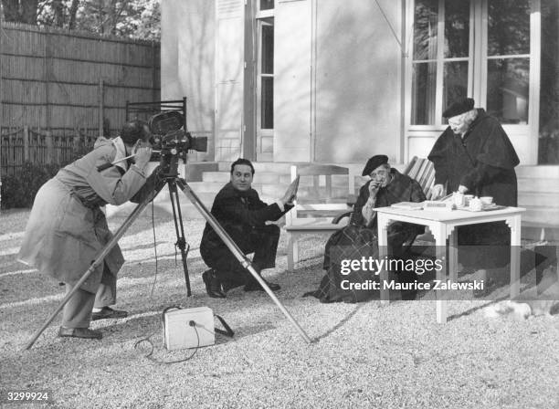 The set of the film 'La Vie Dramatique D'Utrillo' with Utrillo, played by Jean Vince, as an old man taking tea on the terrace. Maurice Utrillo...