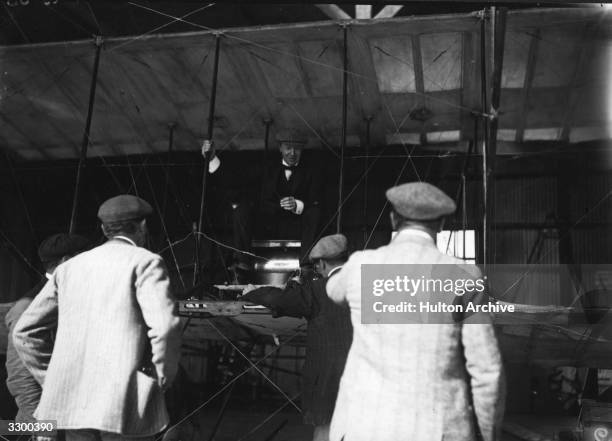 The 2nd Duke of Westminster, Hugh Richard Arthur Grosvenor takes a seat in Mr Rawlinson's plane.