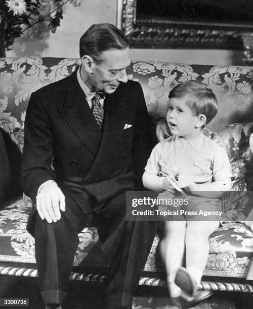 King George VI with Prince Charles on his third birthday.