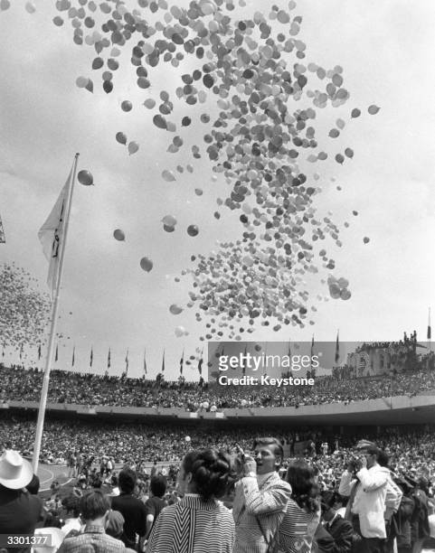 Balloons being released over the stadium at the opening ceremony of the Olympic Games in Mexico City.