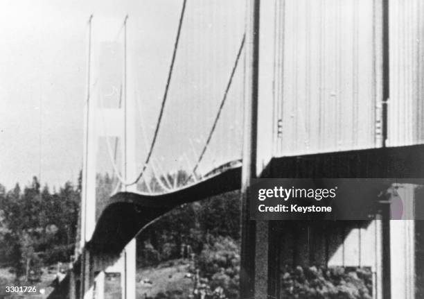 Tacoma Narrows suspension bridge, in Puget Sound, Washington, vibrating violently just prior to its collapse due to hurricane winds causing a violent...