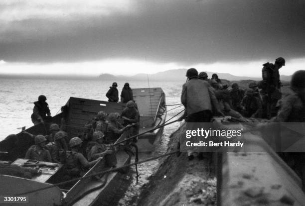 Marines landing at Inchon in South Korea during the first significant counter-strike of the Korean War. Original Publication: Picture Post - 5086 -...