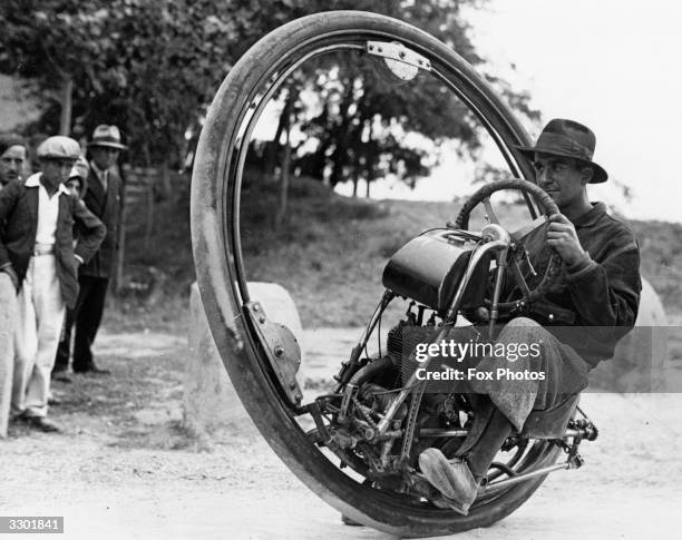 Swiss engineer M Gerder at Arles, France on his way to Spain in his 'Motorwheel', a motorcycle with a wheel which runs on a rail placed inside a...