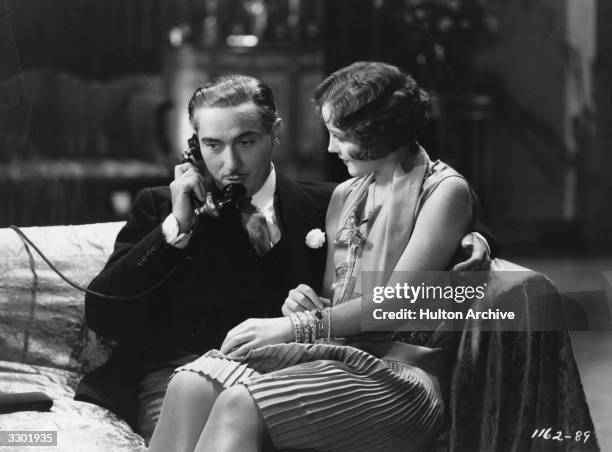 Paul Lukas and Nancy Carroll formerly Ann La Hiff, the leading lady are in romantic mood in a scene from 'Shopworn Angel', directed by Richard...