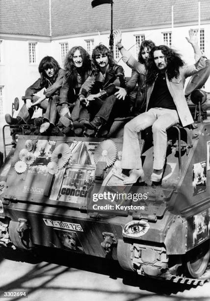 British pop rock group Uriah Heep arrive sitting on the back of a tank at the Benrather Castle in Germany to promote their current tour of the...