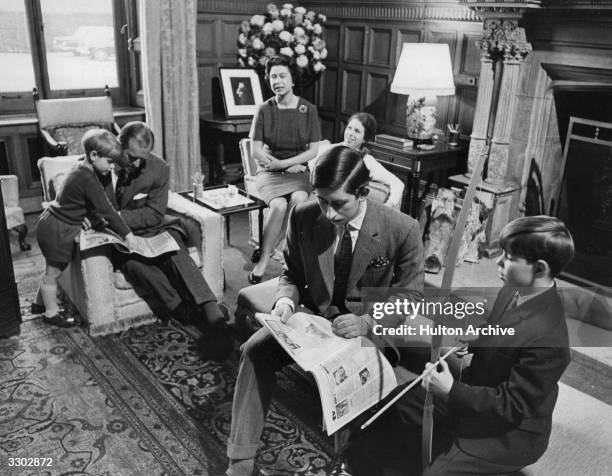 The Royal Family relaxing in a drawing room at Sandringham House, Norfolk Prince Edward, Prince Philip, Duke of Edinburgh, Queen Elizabeth II,...