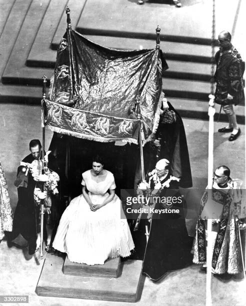 The canopy is placed over the Queen for the anointing ceremony during her coronation.