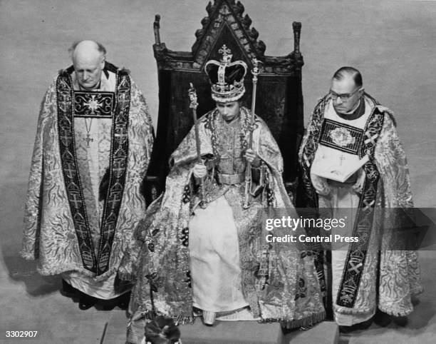 The Queen holding her symbols of office after the coronation ceremony.