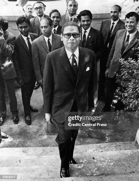 Mr Justice Abu Sayeed Chowhury, High Commissioner of Bangladesh in Britain, with his staff in front of the Bangladesh High Commission which he opened...