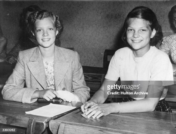 Princess Birgitta of Sweden , with a schoolmate, at her public school in Stockholm.