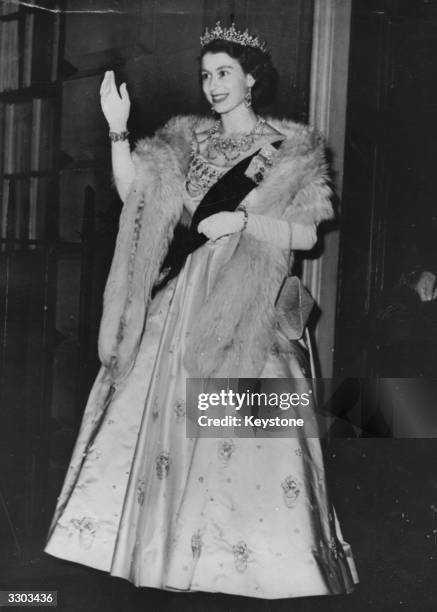 Queen Elizabeth II arriving at an evening function shortly after the death of her father, King George VI.