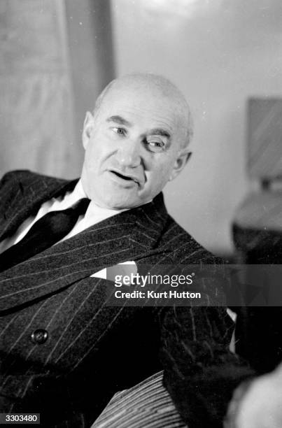 Polish born American film producer, Samuel Goldwyn , answering questions, during a visit to London on behalf of the US government to discuss aspects...