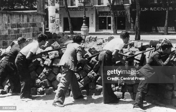 Civilians man the barricades in Barcelona, during the civil war.