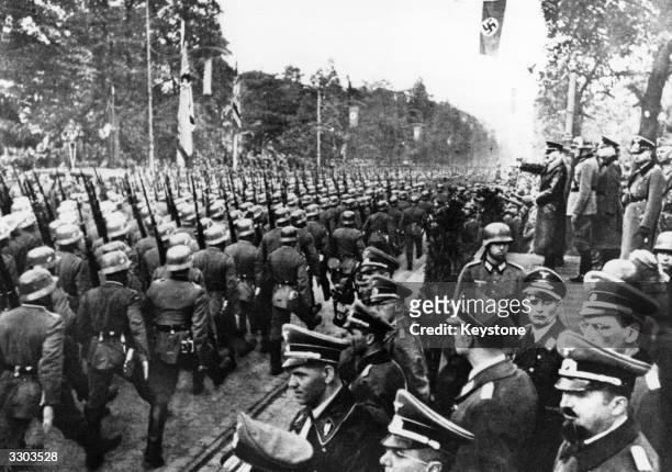 German troops parade in front of Adolf Hitler and Nazi Generals after entry into Warsaw.