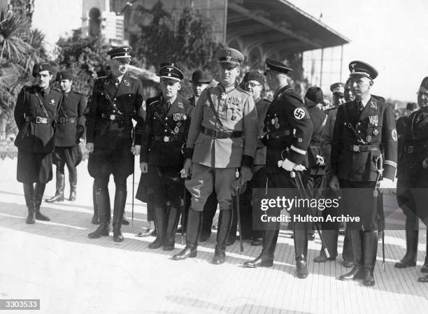 Reinhard Heydrich , deputy Gestapo chief, also known as 'The Hangman', seen here in the centre of a group of German Police officials during a visit...