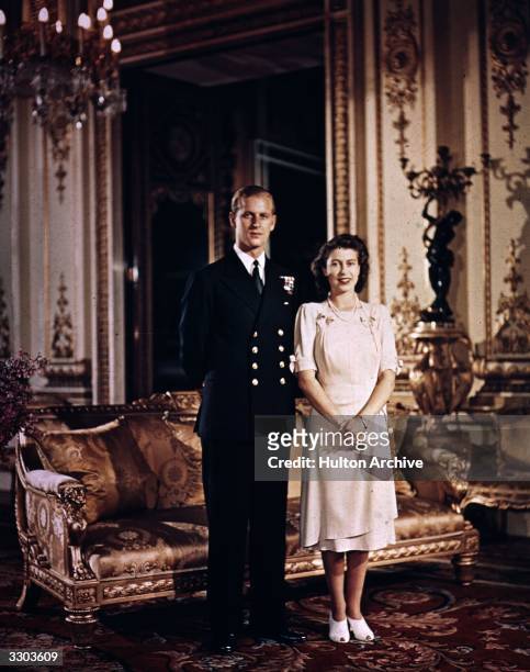 Princess Elizabeth and Philip Mountbatten, Duke of Edinburgh, at Buckingham Palace shortly before their wedding, 1947.
