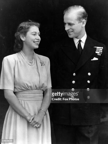 Princess Elizabeth and Philip Mountbatten, Duke of Edinburgh, on the occasion of their engagement at Buckingham Palace in London, July 1947.