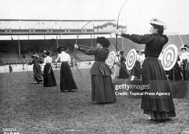 Women archers participating in the National Round at the 1908 London Olympics, which was won by Sybil 'Queenie' Newall of Great Britain.