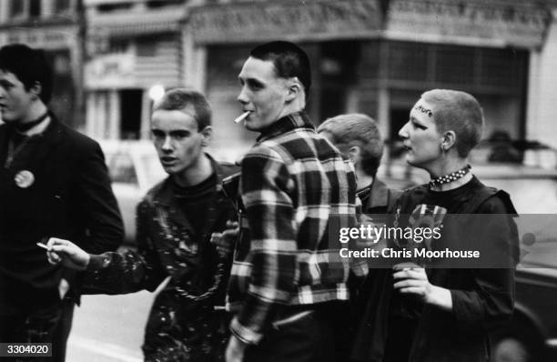 Young punks queuing outside the Rainbow, London, to see The Clash and The Jam in concert.