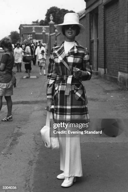 Miss Daphne Barry modelling her trouser suit and jacket at Ascot.