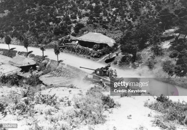 An American tank takes on a South Korean village during the Korean War.