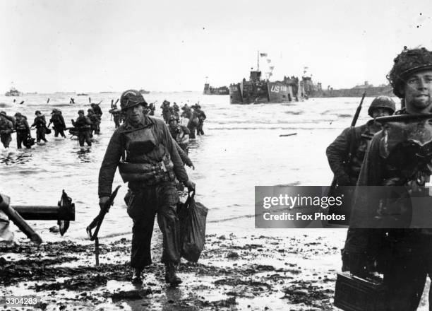 American assault troops wading ashore on Omaha beachhead in Normandy.