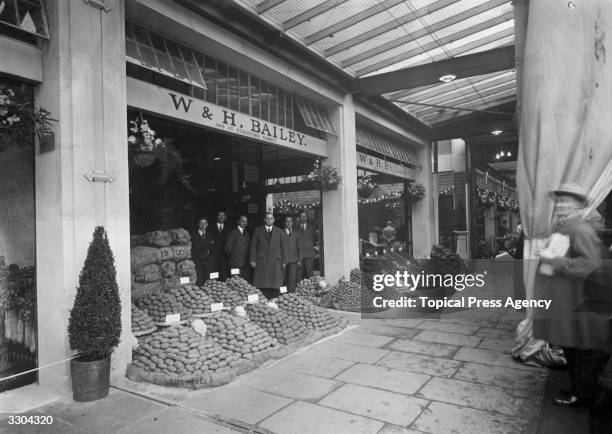 W & H Bailey's stand at Spitalfields Market with a display of potatoes.