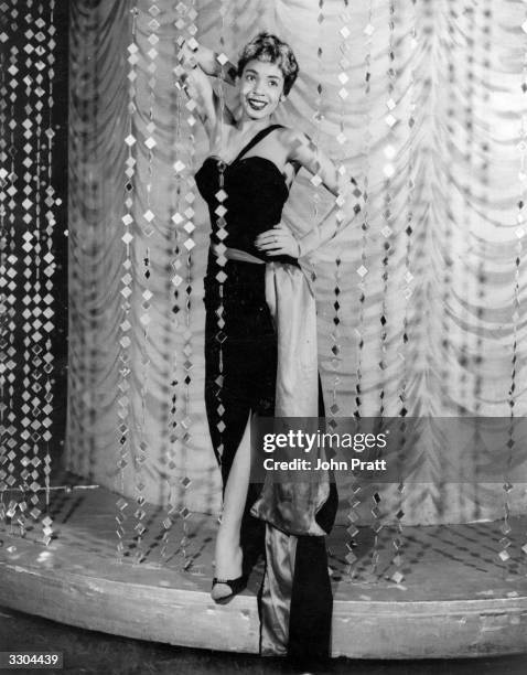 Welsh pop singer Shirley Bassey strikes a pose, circa 1955.