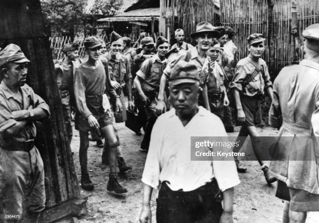 Japanese Pow Color Japanese soldiers turn away as British and Australian soldiers stream ...
