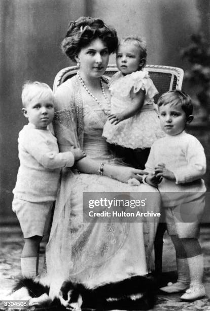 Queen Victoria Eugenie of Spain , wife of King Alfonso XIII of Spain, whom she married in 1906, with her children. From left, Prince Alfonso ,...