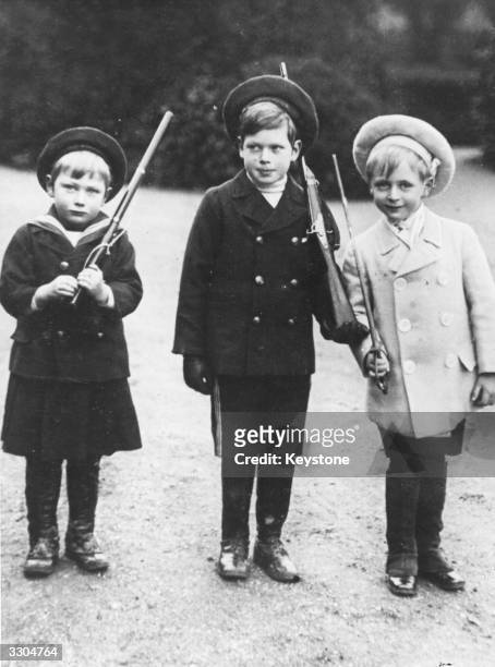 From left, Prince John , and Prince George , two of King George V's children, and their cousin Prince Olav , son of King Haakon VII of Norway and...