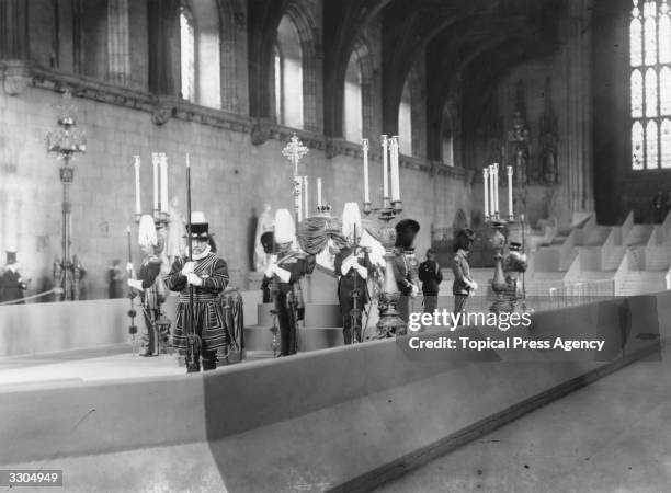 The draped coffin of King Edward VII, , lies in state in Westminster Hall, Westminster Abbey, London. He was succeeded by his son, who became King...