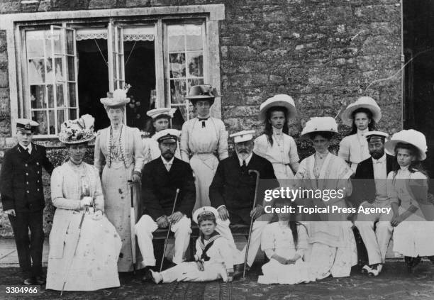 Standing from left to right, King Edward VIII , Duke of Windsor, then Prince Edward; Queen Mary , then Duchess of York; Queen Alexandra ; Mary,...