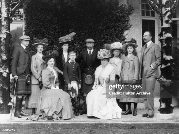 In the centre, King George VI, , as Prince Albert, his father King George V, , his mother Queen Mary, and third from right, his sister, Mary,...
