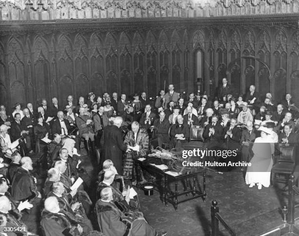 The presentation of an honour to Arthur James Balfour , British statesman.