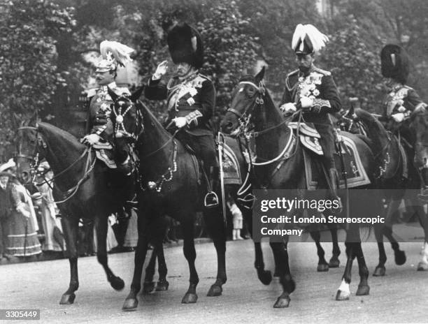 Edward VII, , the British monarch since 1901, , and his son the Duke of York, , return from Trooping the Colour in London.